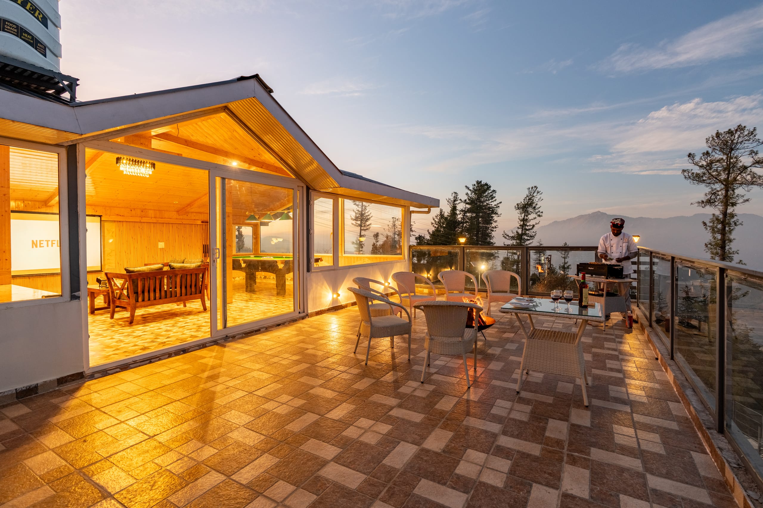 Chef preparing BBQ on mountain terrace